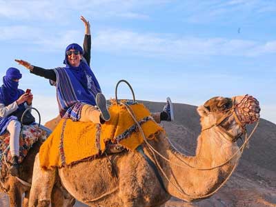 Rocky lunar landscape of Agafay Desert with luxury camp tents near Marrakech