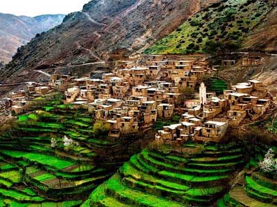 Snow-capped High Atlas Mountains peaks with Berber villages in the valley below